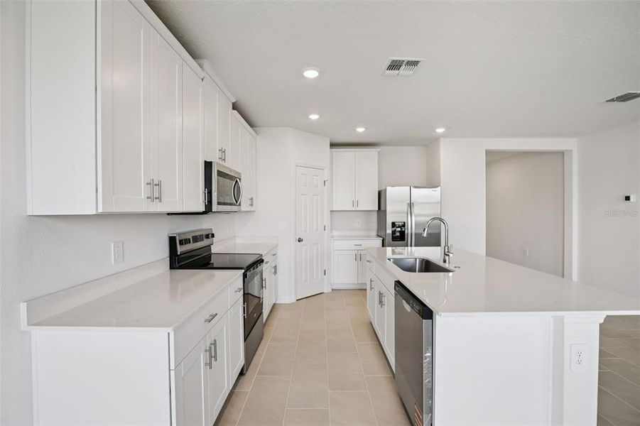Furnished interior view inside a new home in Villamar - Signature Series, Winter Haven (Image 8).