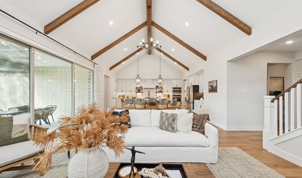 Great room with high ceilings and stained ceiling beams
