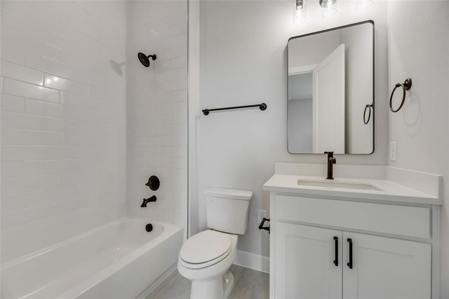 Bathroom featuring vanity and bathtub / shower combination