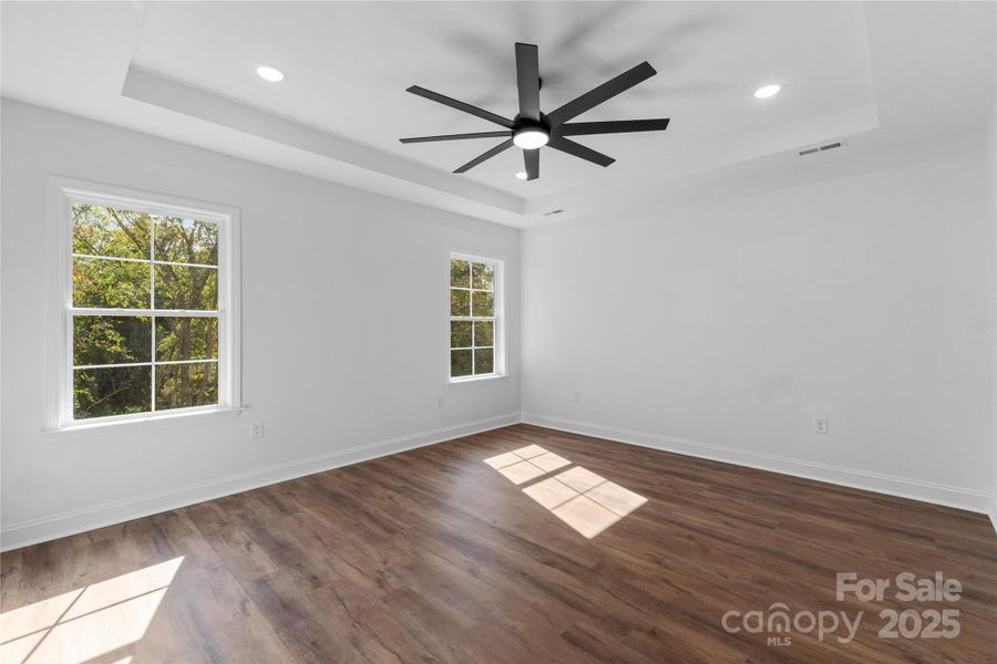 primary bedroom w/ tray ceiling primary bedroom w/ tray ceiling
