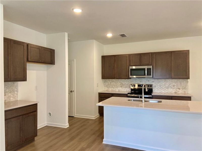 Furnished interior view inside a new home in Eastlyn Crossing, Flowery Branch (Image 7).