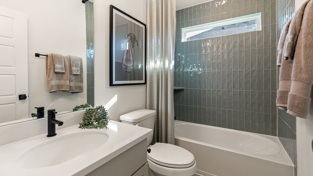 Representative furnished interior of a home built from the Rosewood by Brightland Homes in Sunterra, Katy (Image 19).