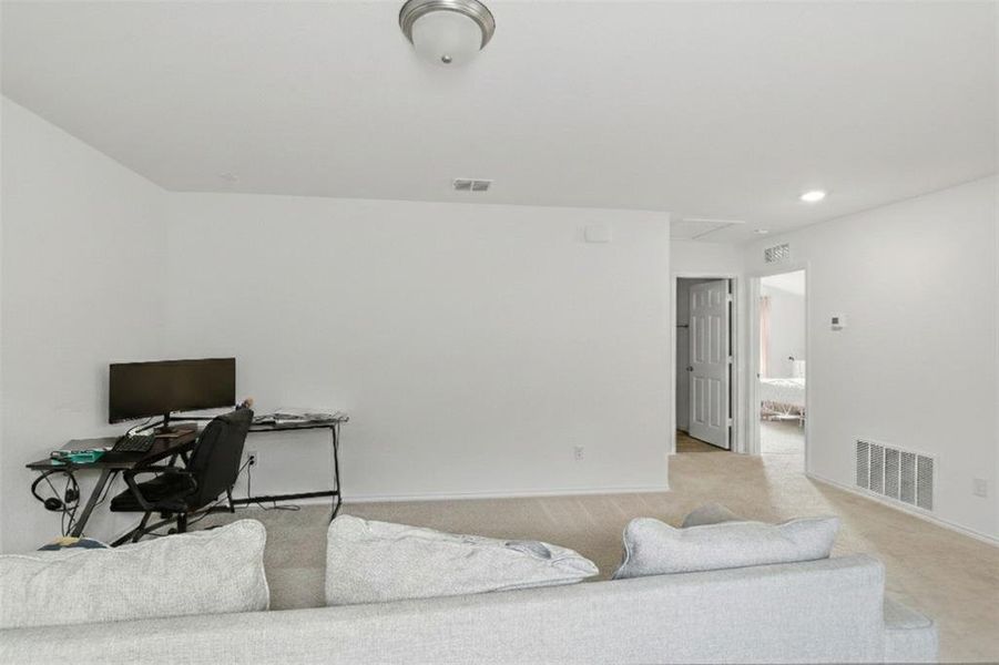 Living area upstairs currently used as office