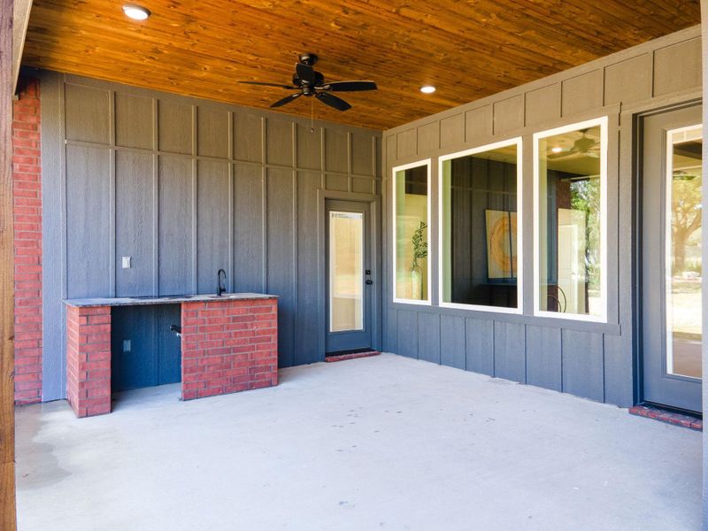 View of patio featuring ceiling fan