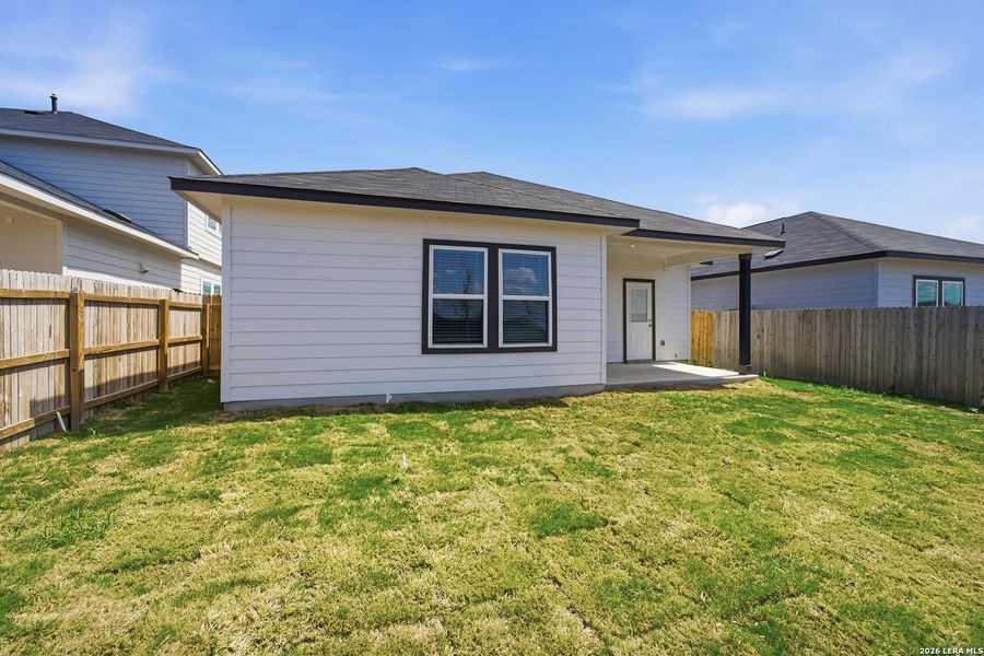 Exterior details and patio area of a home in Mesa Vista, Von Ormy (Image 4).