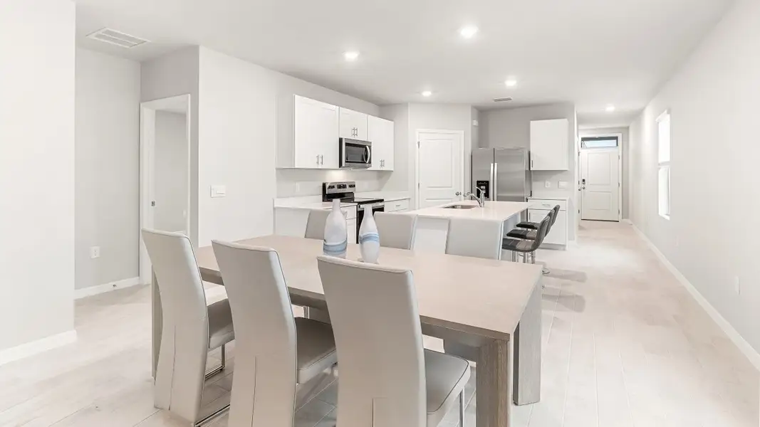 Furnished interior view inside a new home in Coral Bay - Express & Tradition, North Fort Myers (Image 4).