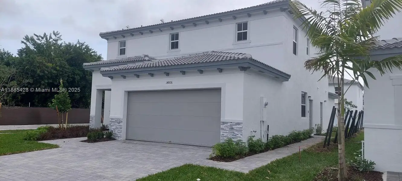 Front exterior of a new home in , Miami, FL, highlighting curb appeal (Image 1).