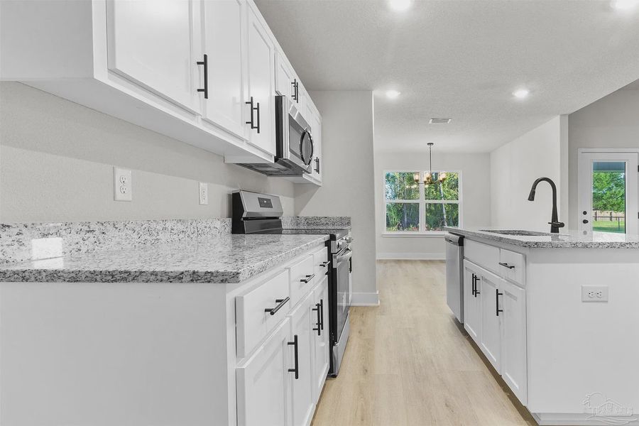 Furnished interior view inside a new home in Pecan Valley, Cantonment (Image 4).
