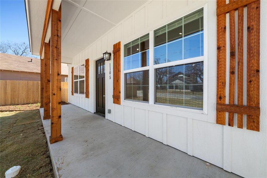 View of patio / terrace featuring covered porch and fence View of patio / terrace featuring covered porch and fence