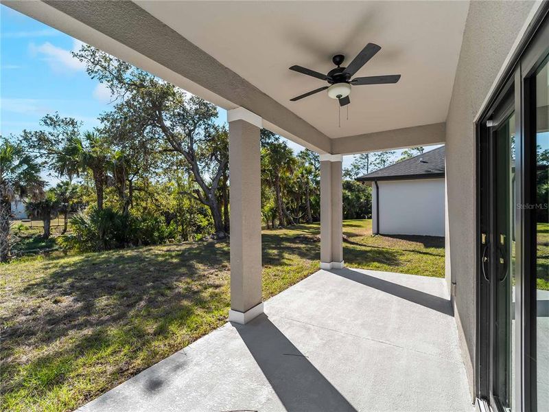 Exterior details and patio area of a home in , North Port (Image 33).