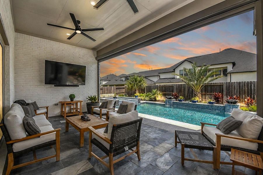 Slate patio floors, 2 large ceiling fans and a high-end, heavy-duty, high-wind motorized shade for the large covered patio. Slate patio floors, 2 large ceiling fans and a high-end, heavy-duty, high-wind motorized shade for the large covered patio.