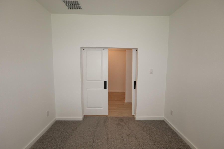 Spacious, unfurnished interior of a new home in Tarkington Timbers, Cleveland (Image 21).