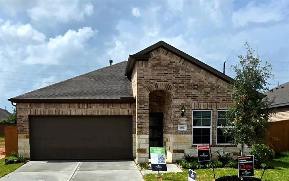 Front exterior of a new home in Sunterra, Katy, TX, highlighting curb appeal (Image 74). Front exterior of a new home in Sunterra, Katy, TX, highlighting curb appeal (Image 74).