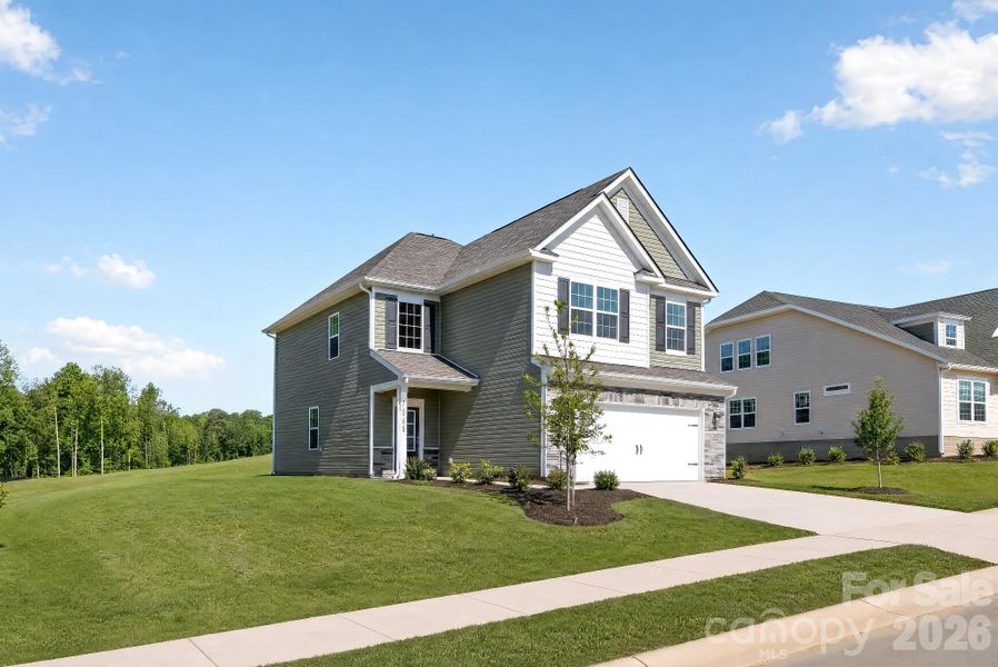 Front exterior of a new home in Shannon Woods, Maiden, NC, highlighting curb appeal (Image 17). Front exterior of a new home in Shannon Woods, Maiden, NC, highlighting curb appeal (Image 17).
