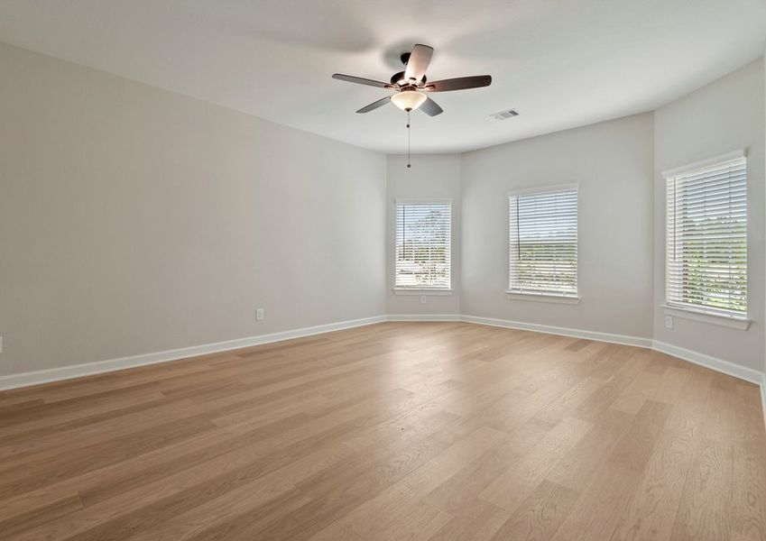 Luxury master bedroom with bay windows