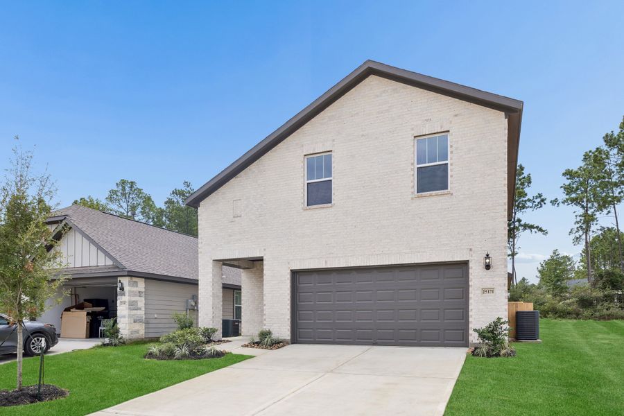 Front exterior of a new home in Magnolia Springs, Montgomery, TX, highlighting curb appeal (Image 2). Front exterior of a new home in Magnolia Springs, Montgomery, TX, highlighting curb appeal (Image 2).