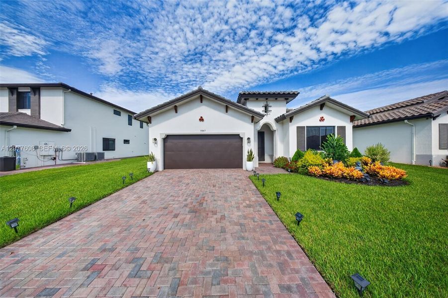 Front exterior of a new home in , Immokalee, FL, highlighting curb appeal (Image 29).