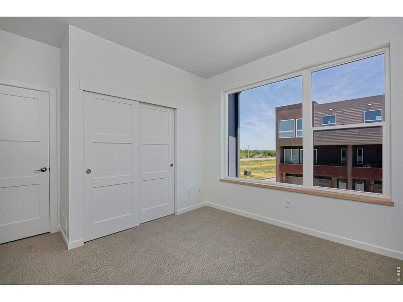 Spacious, unfurnished interior of a new home in West Grange, Longmont (Image 20).