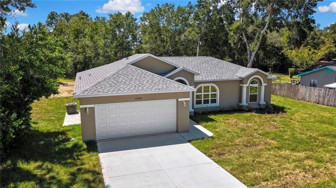 Front exterior of a new home in , Brooksville, FL, highlighting curb appeal (Image 2).