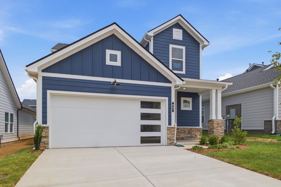 Front exterior of a new home in Nexus – Park Collection, Gallatin, TN, highlighting curb appeal (Image 22).