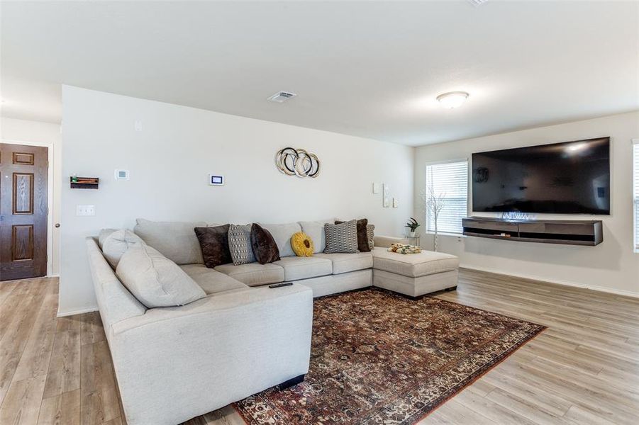 Living room with hardwood / wood-style flooring