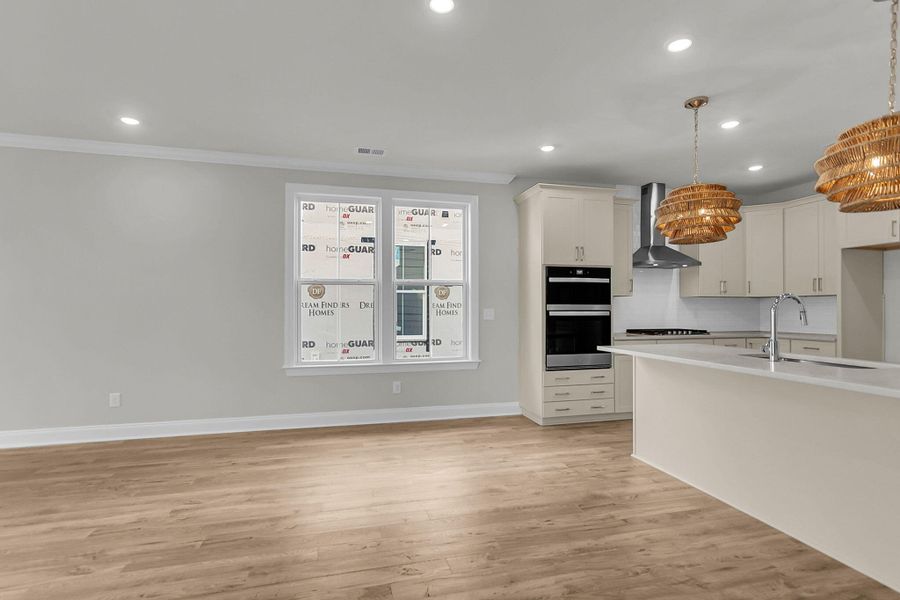 Spacious, unfurnished interior of a new home in Tidewater at Lakes of Cane Bay, Summerville (Image 9).