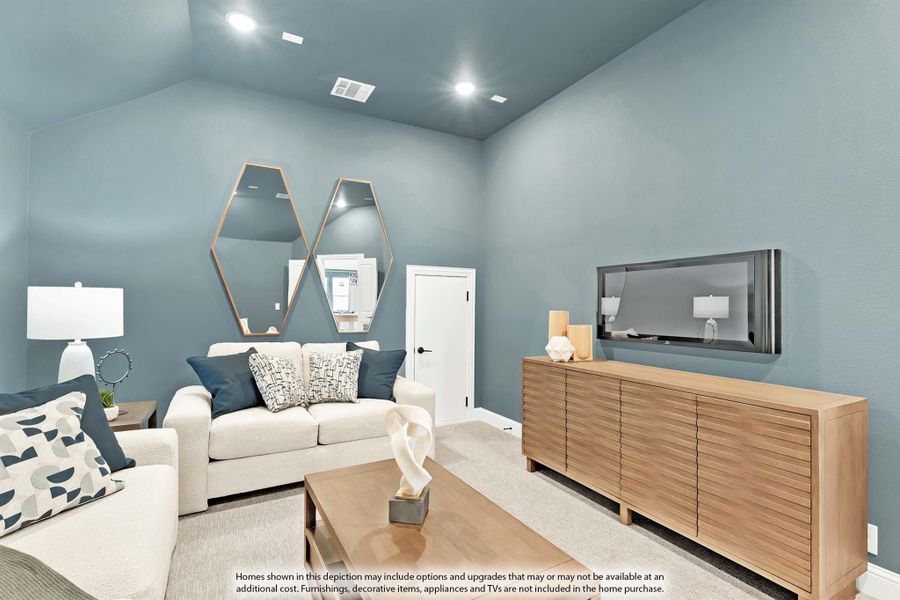 Living room with vaulted ceiling, blue-gray walls, white sofas, wood credenza, and wall-mounted TV Living room with vaulted ceiling, blue-gray walls, white sofas, wood credenza, and wall-mounted TV
