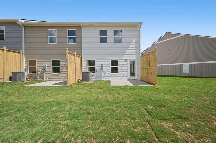 Exterior details and patio area of a home in Village Green, Adairsville (Image 15).