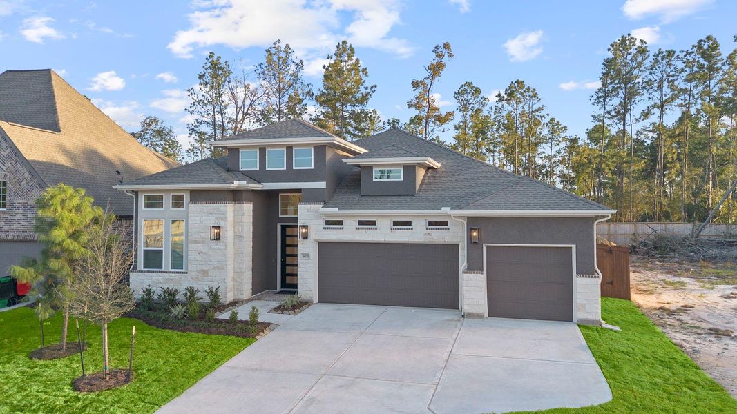 Front exterior of a new home in Evergreen, Conroe, TX, highlighting curb appeal (Image 1).