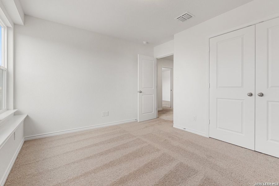 Spacious, unfurnished interior of a new home in Woodside Farms, Seguin (Image 24).