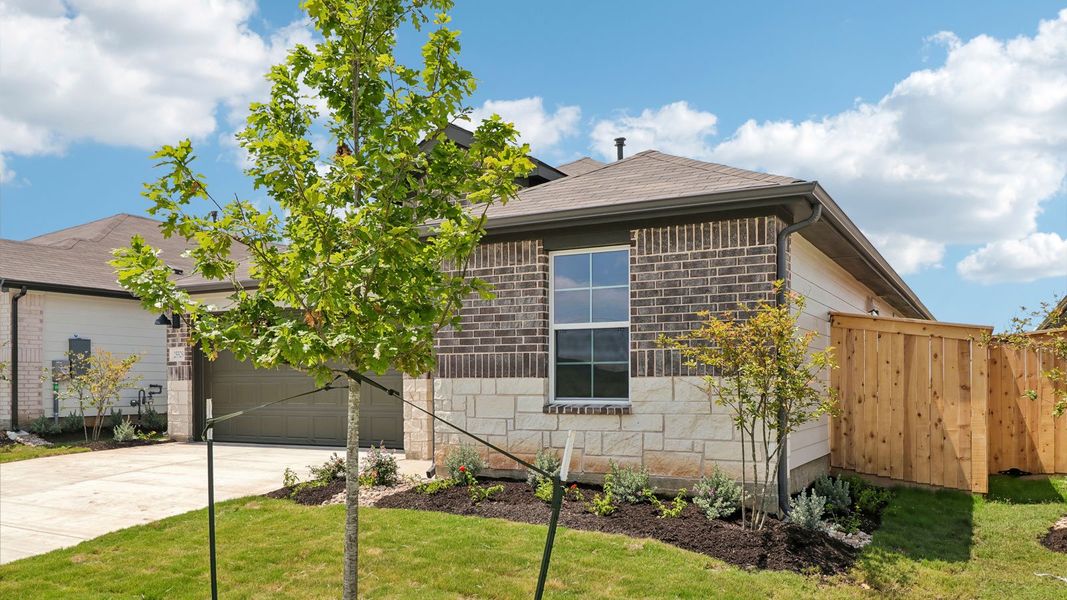 Front exterior of a new home in Briarwood, Elgin, TX, highlighting curb appeal (Image 17). Front exterior of a new home in Briarwood, Elgin, TX, highlighting curb appeal (Image 17).