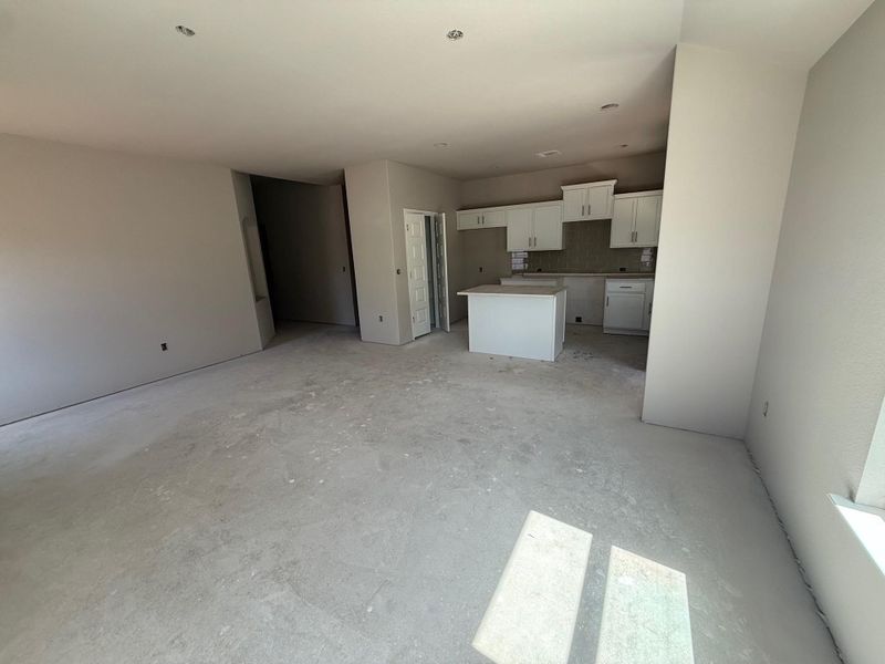 Unfurnished living room with concrete floors