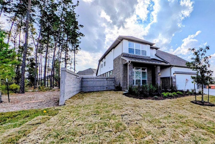 Exterior details and patio area of a home in Artavia, Conroe (Image 29).
