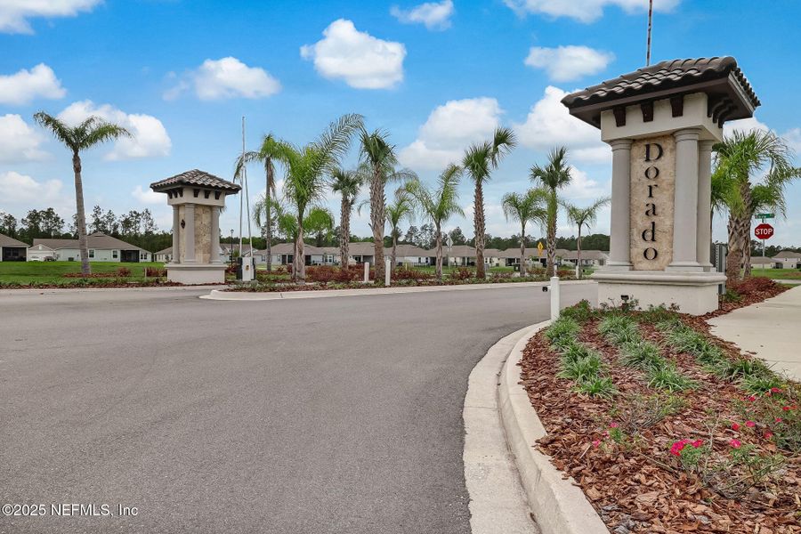 Front exterior of a new home in Dorado at Entrada, St. Augustine, FL, highlighting curb appeal (Image 27).