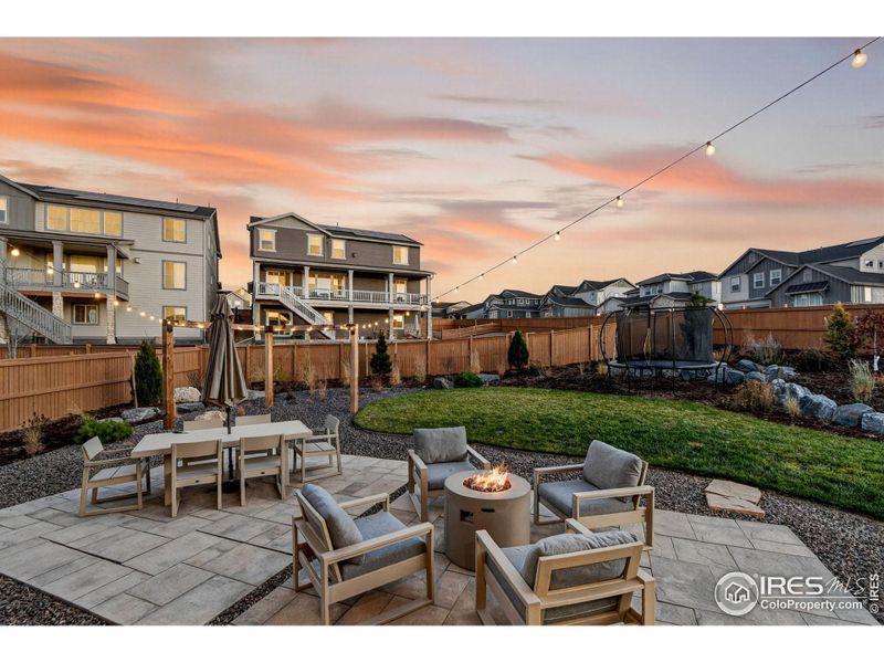 Landscaped backyard with patio, pathways, and low-maintenance design.