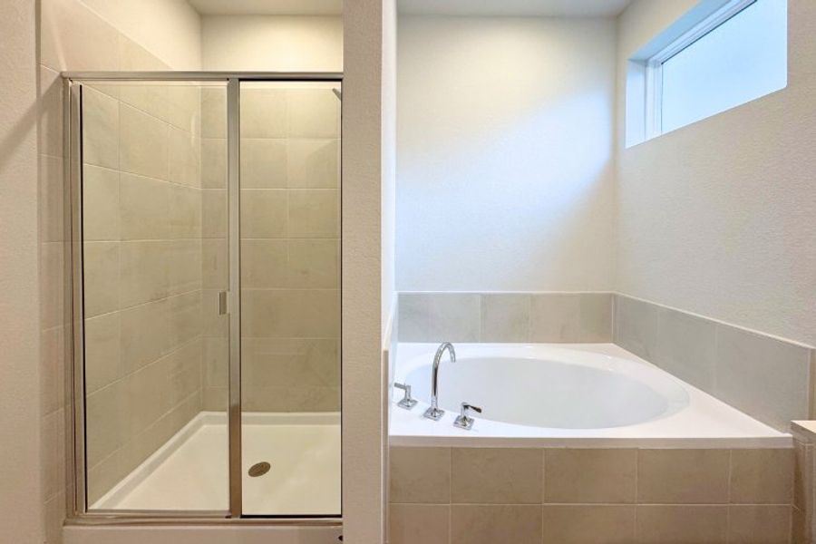A bathroom with a glass shower. A bathroom with a glass shower.