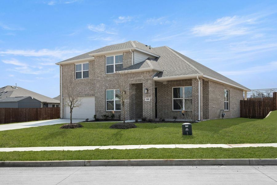 Front exterior of a new home in Stone Eagle, Azle, TX, highlighting curb appeal (Image 2).