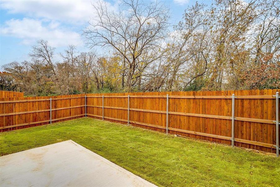 View of yard featuring a patio and a fenced backyard