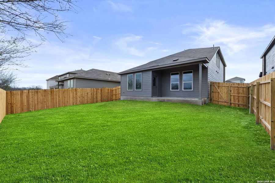 Exterior details and patio area of a home in Hightop Ridge, Converse (Image 2).