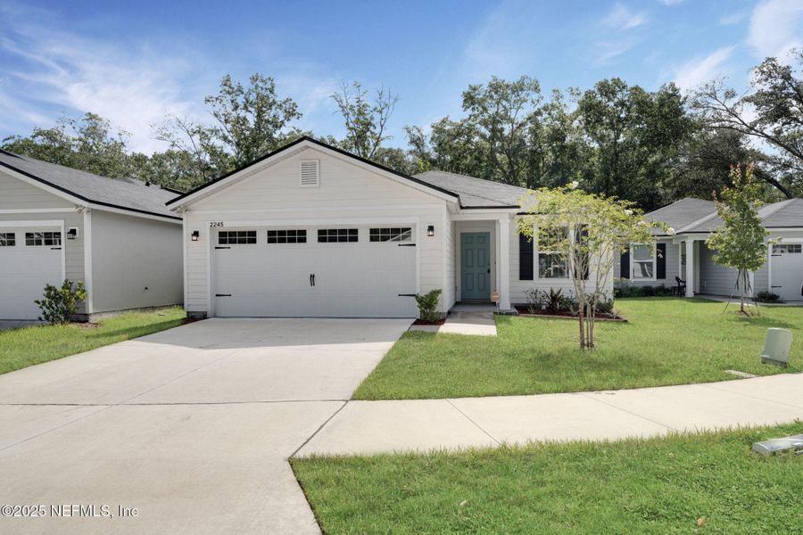 Front exterior of a new home in , Jacksonville, FL, highlighting curb appeal (Image 1). Front exterior of a new home in , Jacksonville, FL, highlighting curb appeal (Image 1).