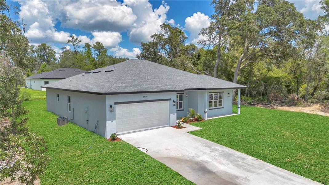Front exterior of a new home in , Ocala, FL, highlighting curb appeal (Image 27).