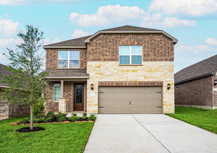 Brick and stone exterior with front yard landscaping