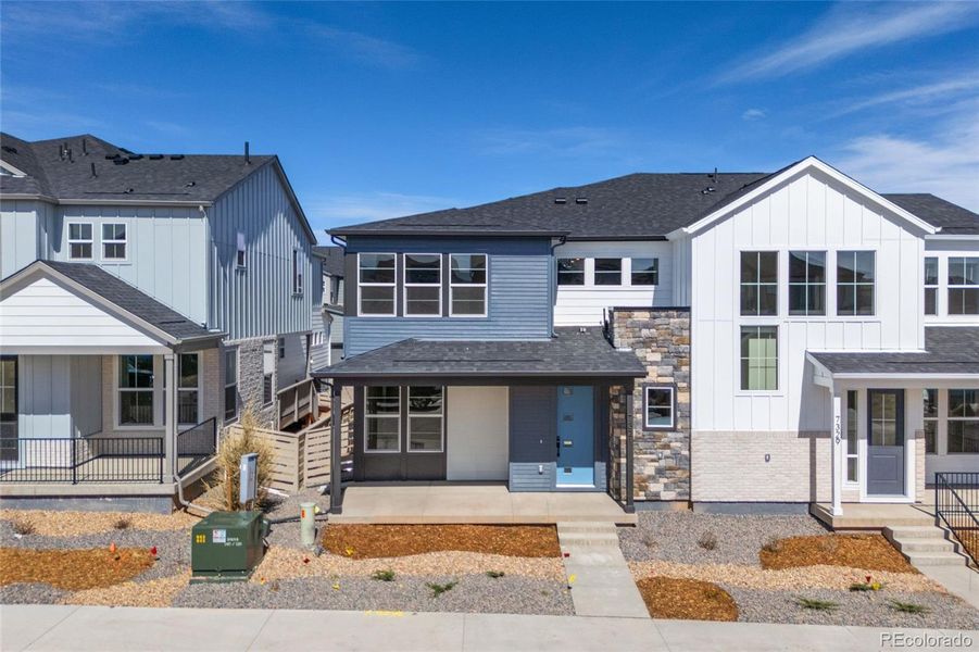 Front exterior of a new home in , Littleton, CO, highlighting curb appeal (Image 16).
