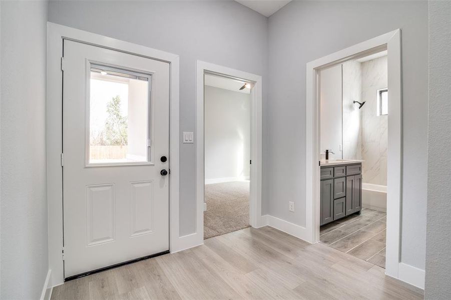 Entryway featuring light hardwood / wood-style floors and sink