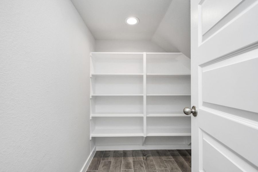 Walk in Pantry for all your food storage needs. Sample photo of completed home with similar floor plan. Actual colors and selections may vary.