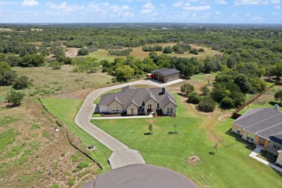 Front exterior of a new home in , Springtown, TX, highlighting curb appeal (Image 18). Front exterior of a new home in , Springtown, TX, highlighting curb appeal (Image 18).