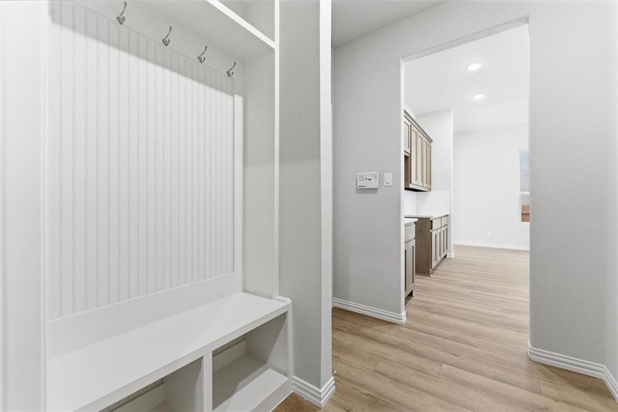 Mudroom featuring light wood-type flooring and recessed lighting