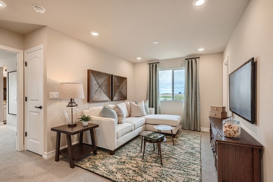 A living room with a large window.