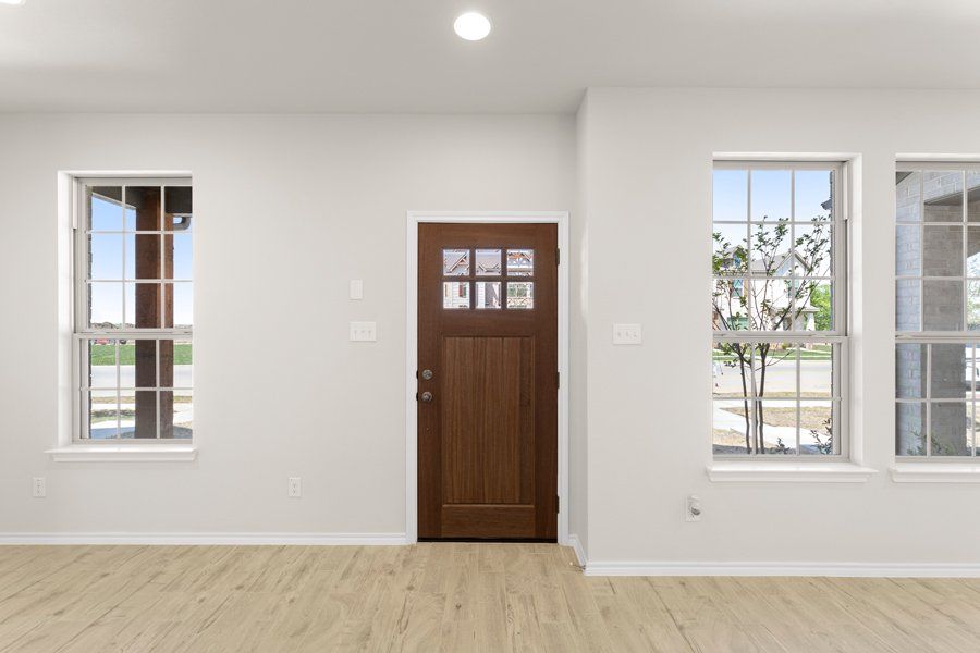 Front exterior of a new home in Sanger Circle, Sanger, TX, highlighting curb appeal (Image 2). Front exterior of a new home in Sanger Circle, Sanger, TX, highlighting curb appeal (Image 2).