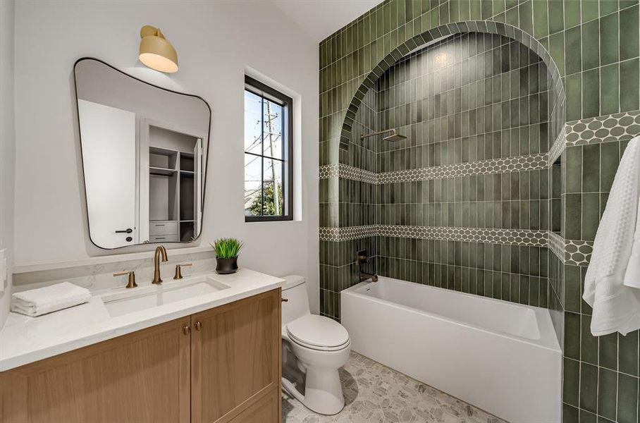 Full bath featuring vanity and  shower combination